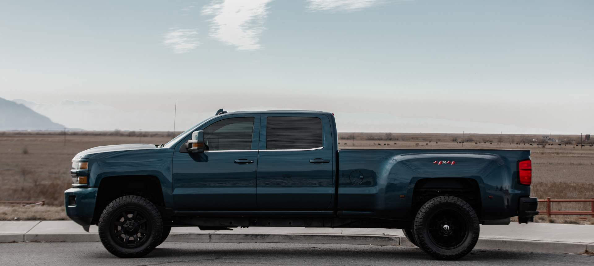 Side profile of Chevrolet Silverado 3500HD 4x4 on Utahn side street near Salt Lake City.