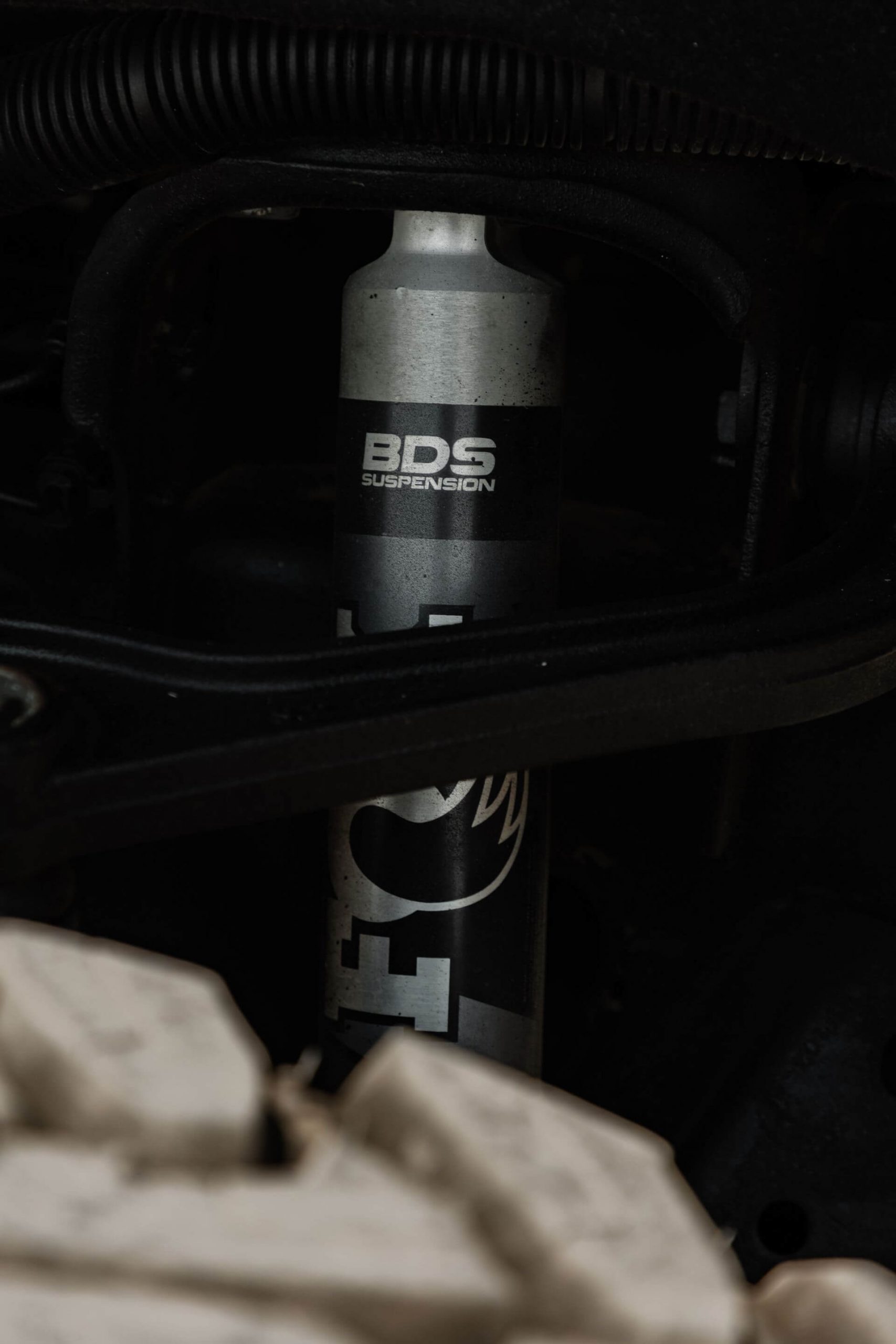 Fox BDS Shock Absorber visible from the wheel well of a custom lifted truck