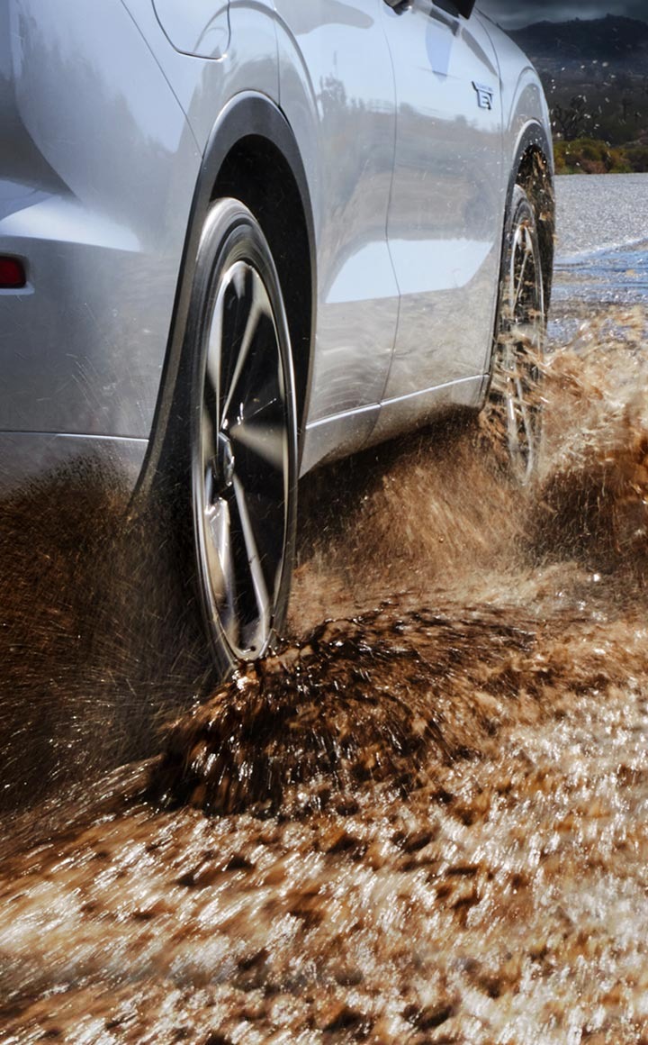 Outlander PHEV driving in low‑grip conditions illustrating S‑AWC