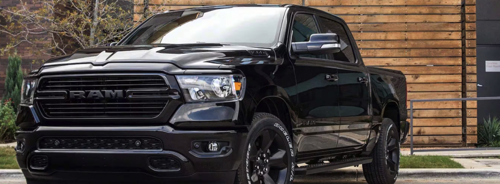 Front view of a Black Ram 1500 parked in a lot