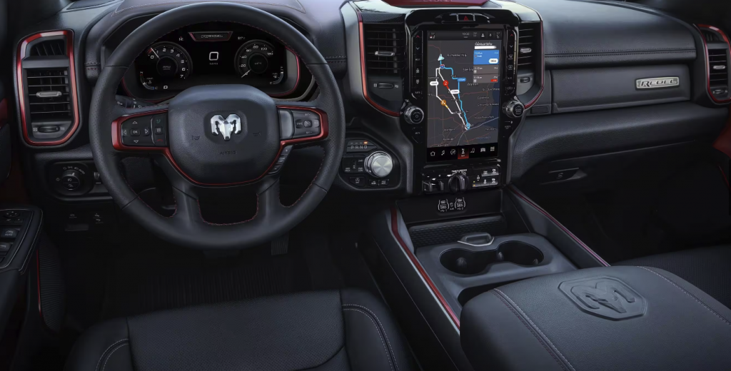 Interior view of a Ram 1500 center console and front steering wheel