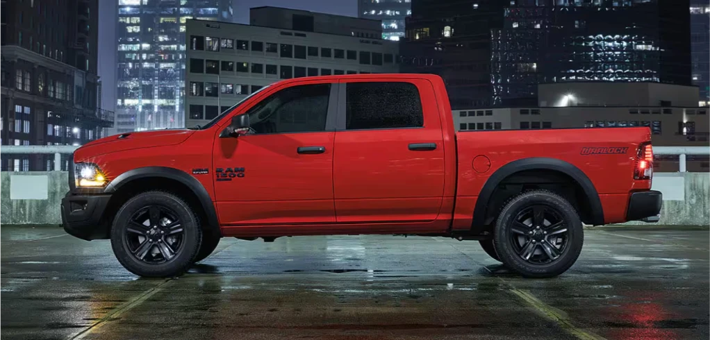 Technician checking oil and fluid levels in a Ram 1500