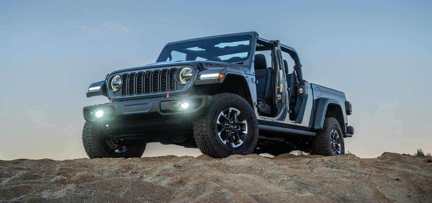 2026 Jeep Gladiator Rubicon with doors removed parked on rocky terrain