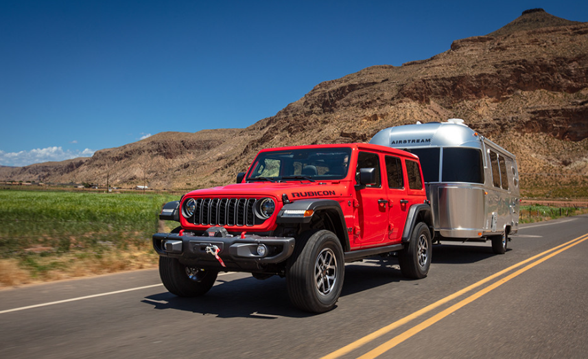 Jeep Wrangler Unlimited with roof top tent set up at Alberta backcountry campsite