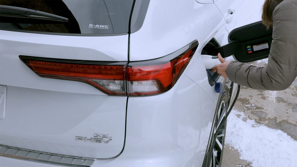 2023 Outlander PHEV SEL Premium Rear Right being plugged in to charge