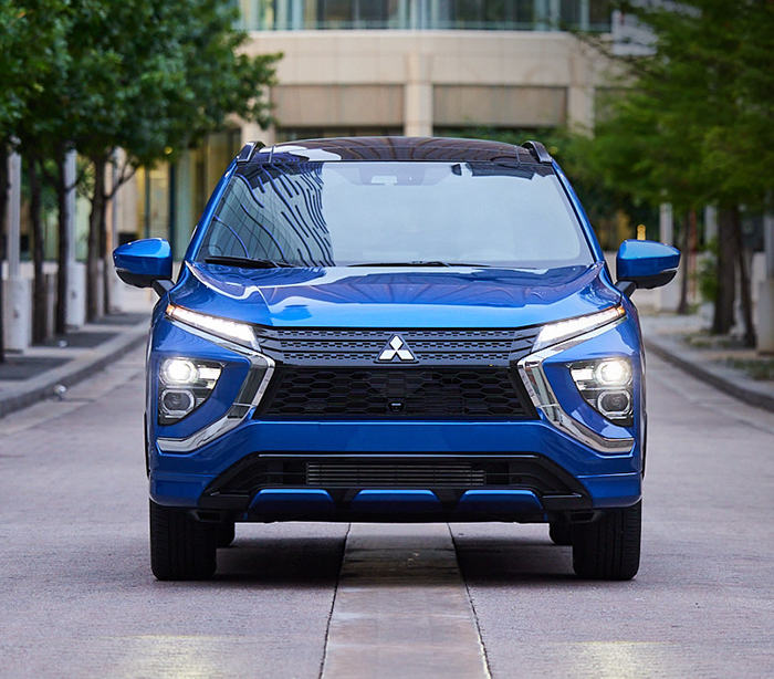 2024 Eclipse Cross SEL Touring parked in a downtown area, front view of vehicle