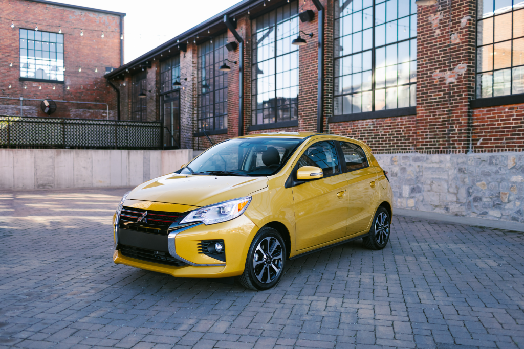 2024 Mirage SE yellow parked in an industrial area