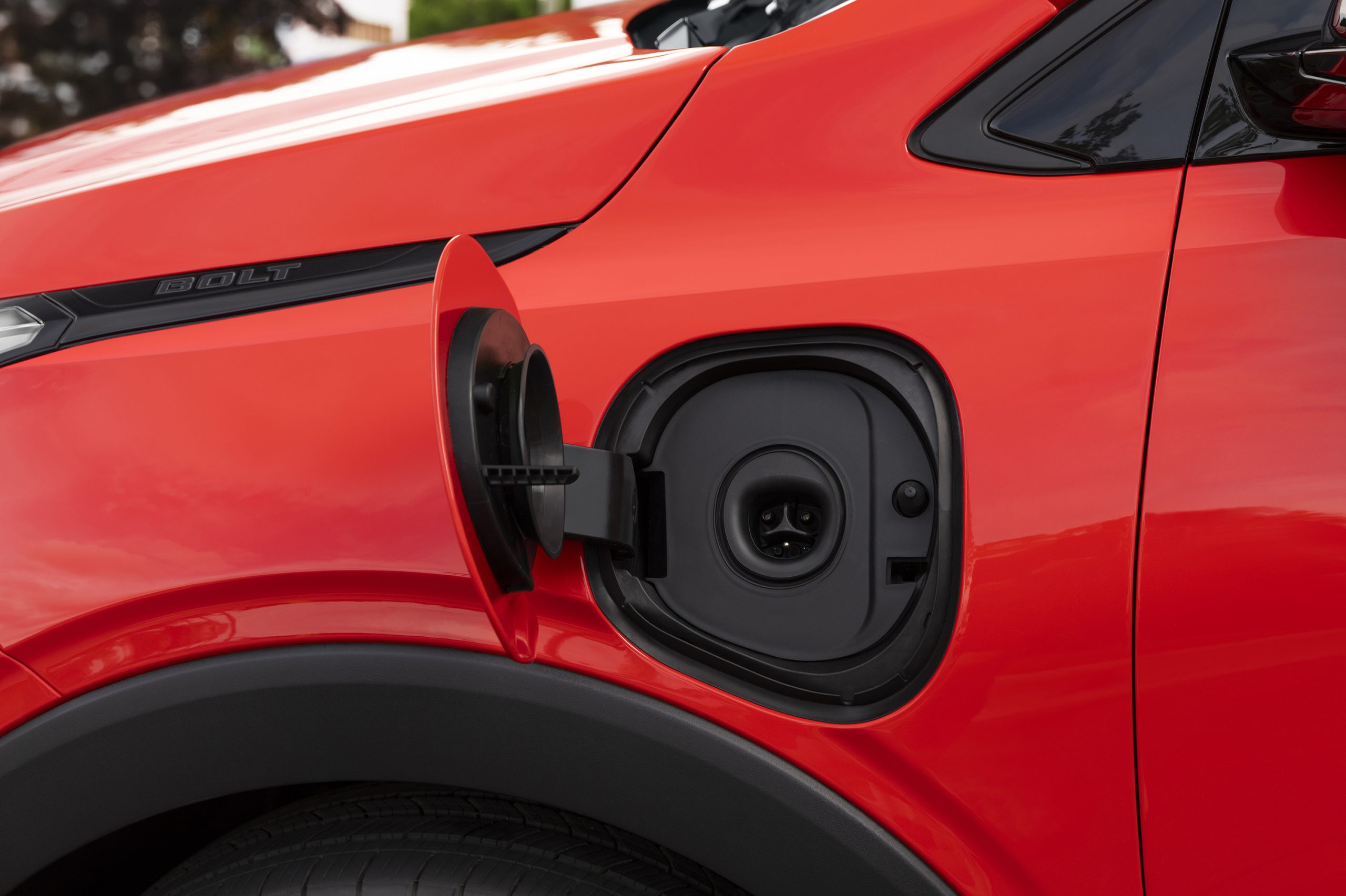 2027 Chevrolet Bolt electric vehicle charging port close-up showing connector design