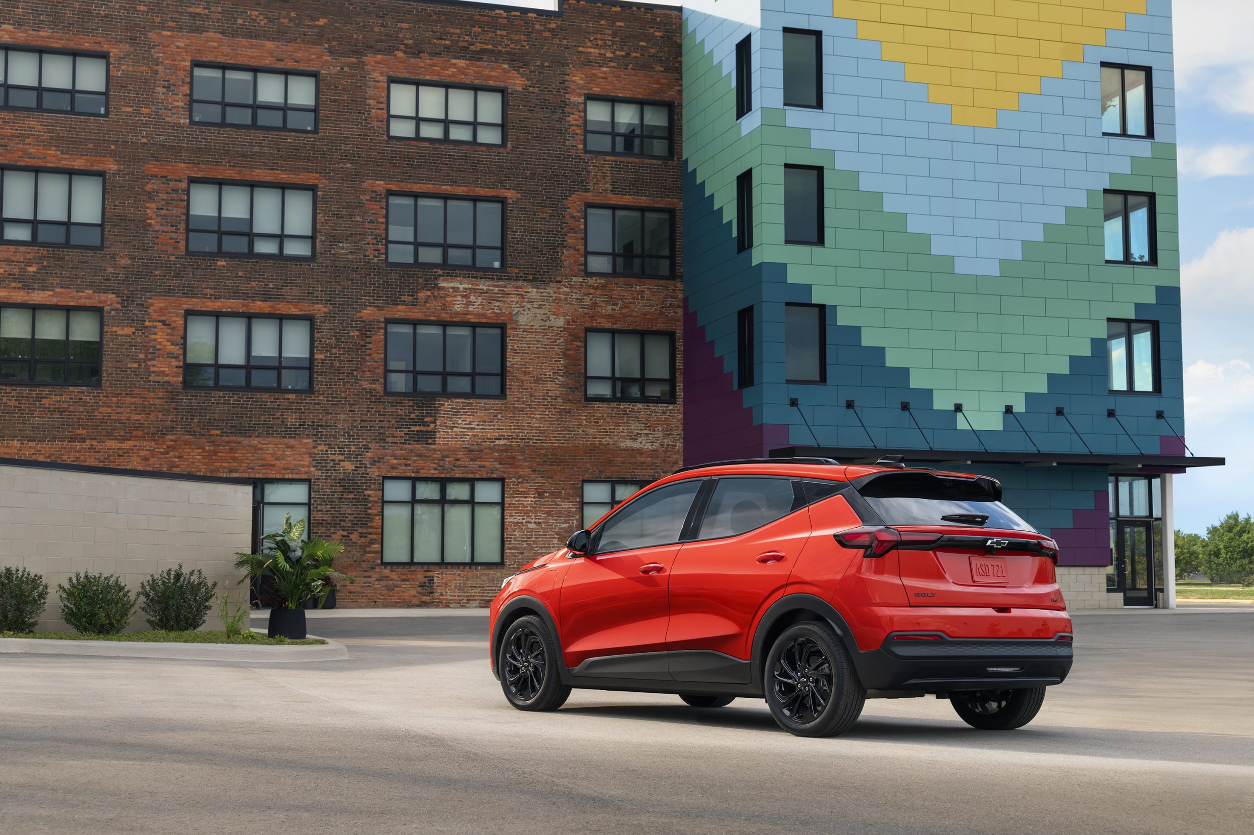 2027 Chevrolet Bolt rear driver side showing LED taillights and hatchback design