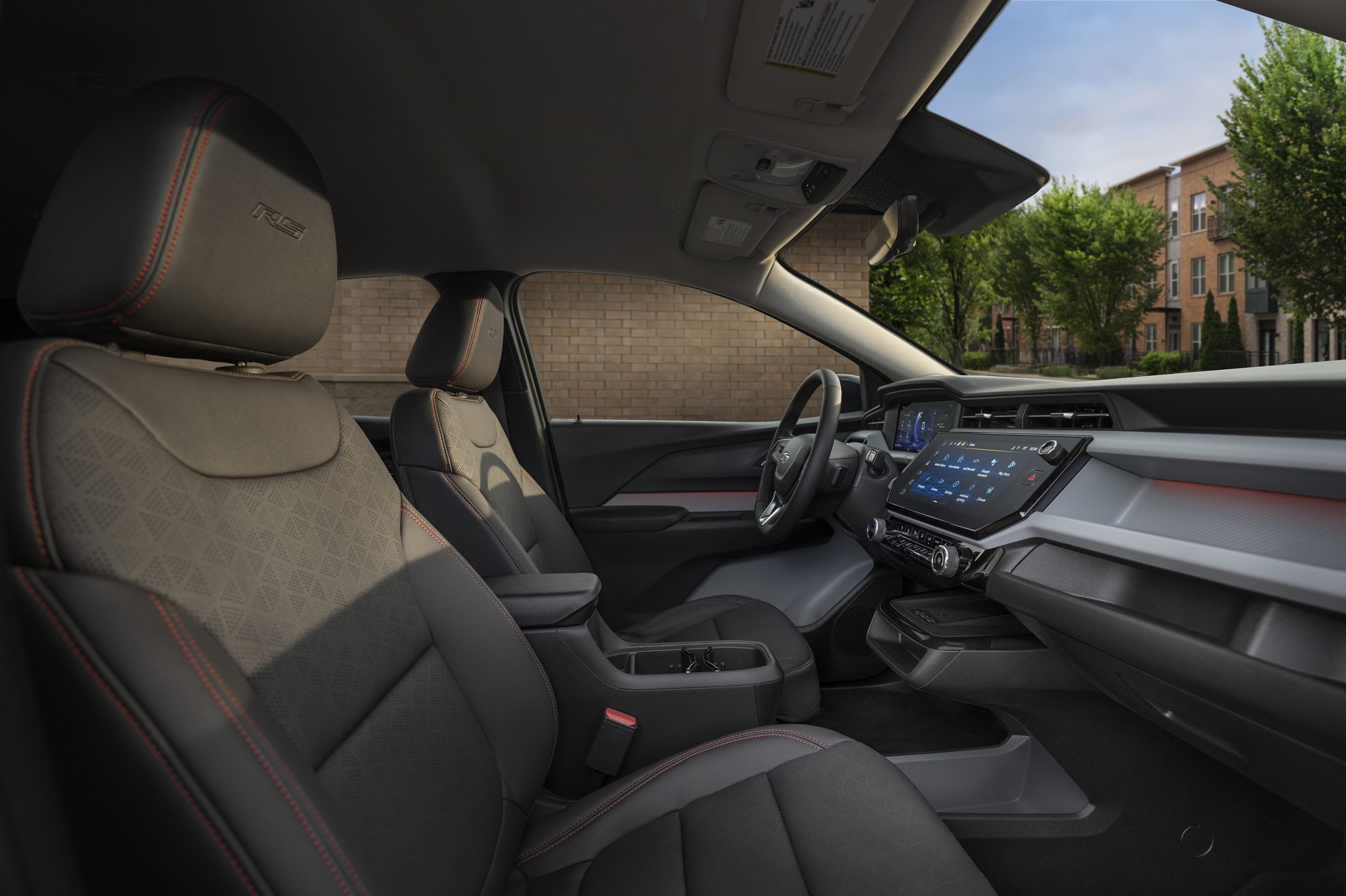 2027 Chevrolet Bolt reveal event stage photo showing new electric vehicle launch