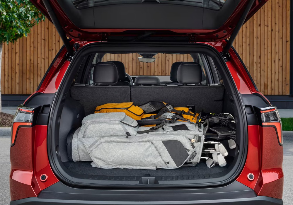 Equinox cargo area with hockey equipment and camping gear