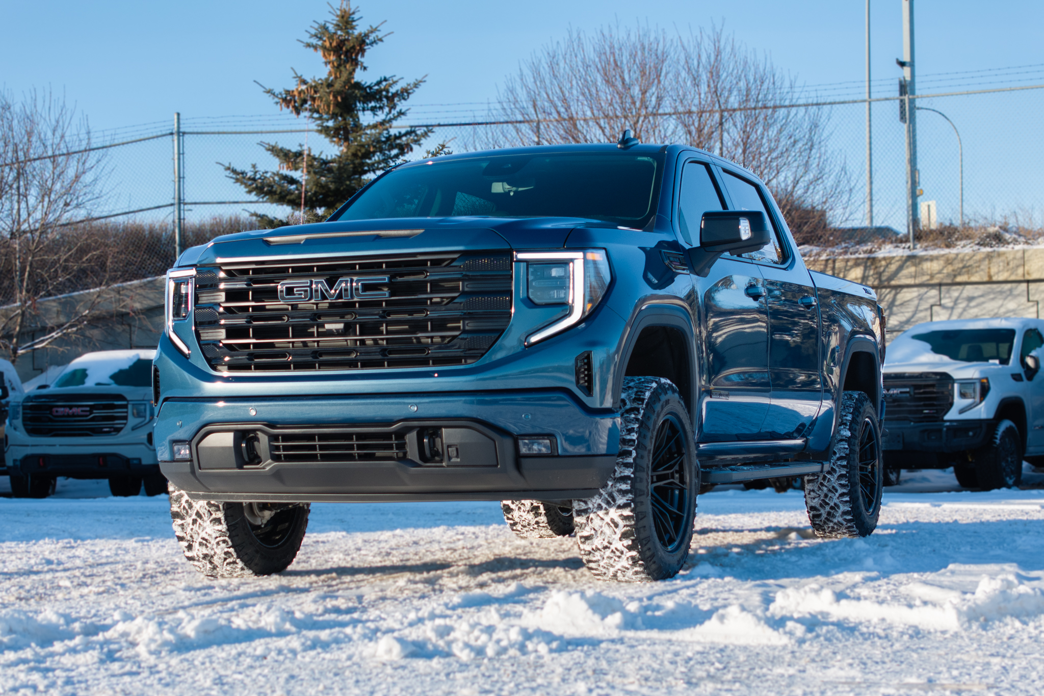Custom two-tone paint-matched emblems complete the build with a bold, cohesive touch