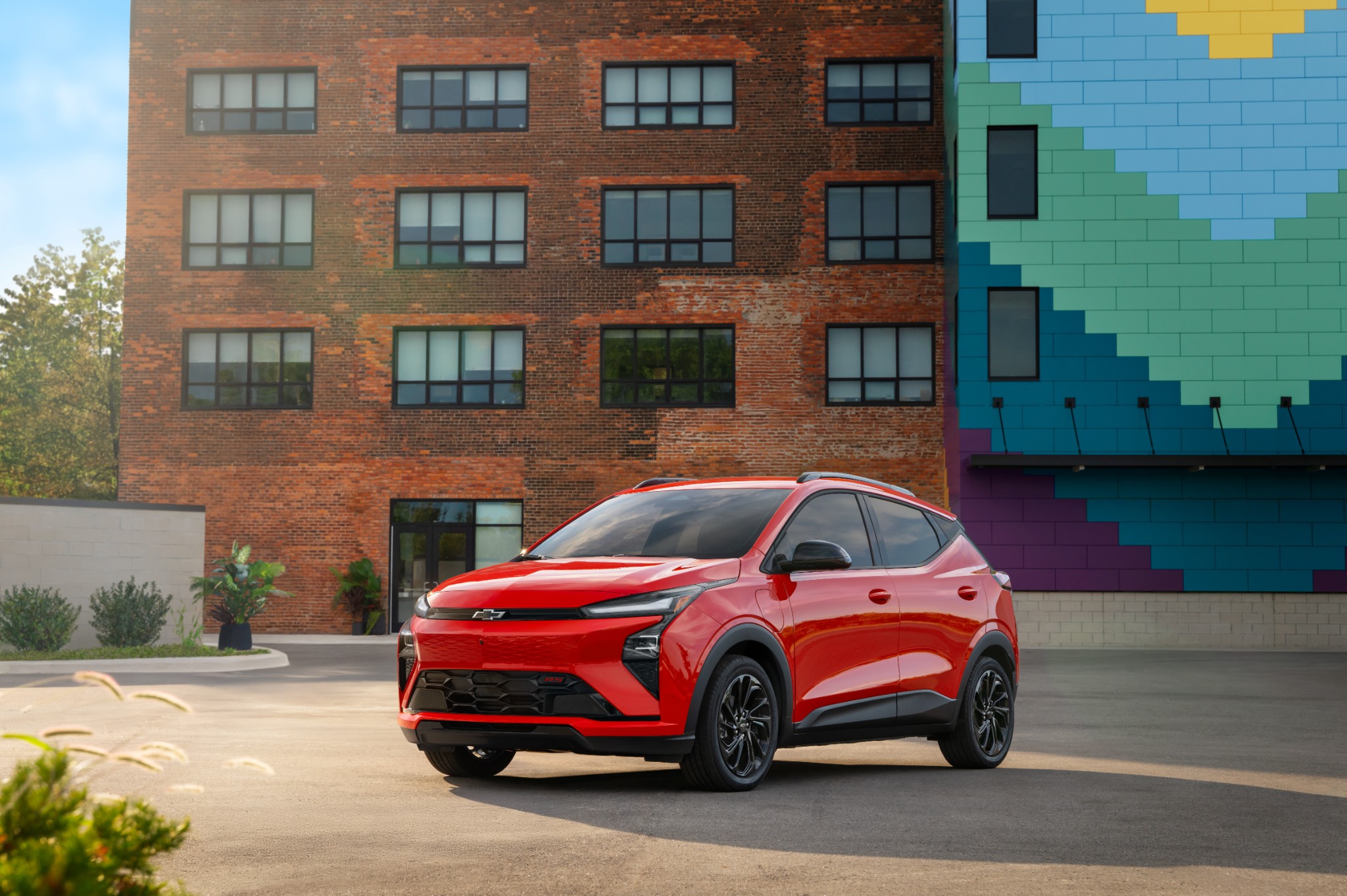2027 Chevrolet Bolt front exterior in red.