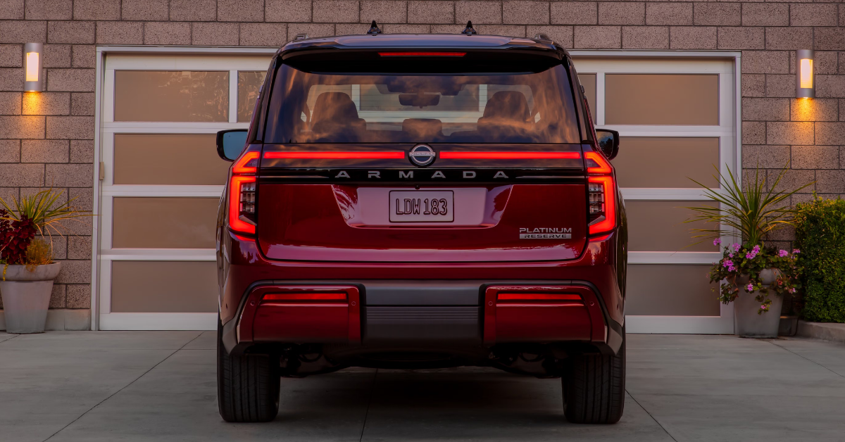 2025 Nissan Armada parked in front of a garage door