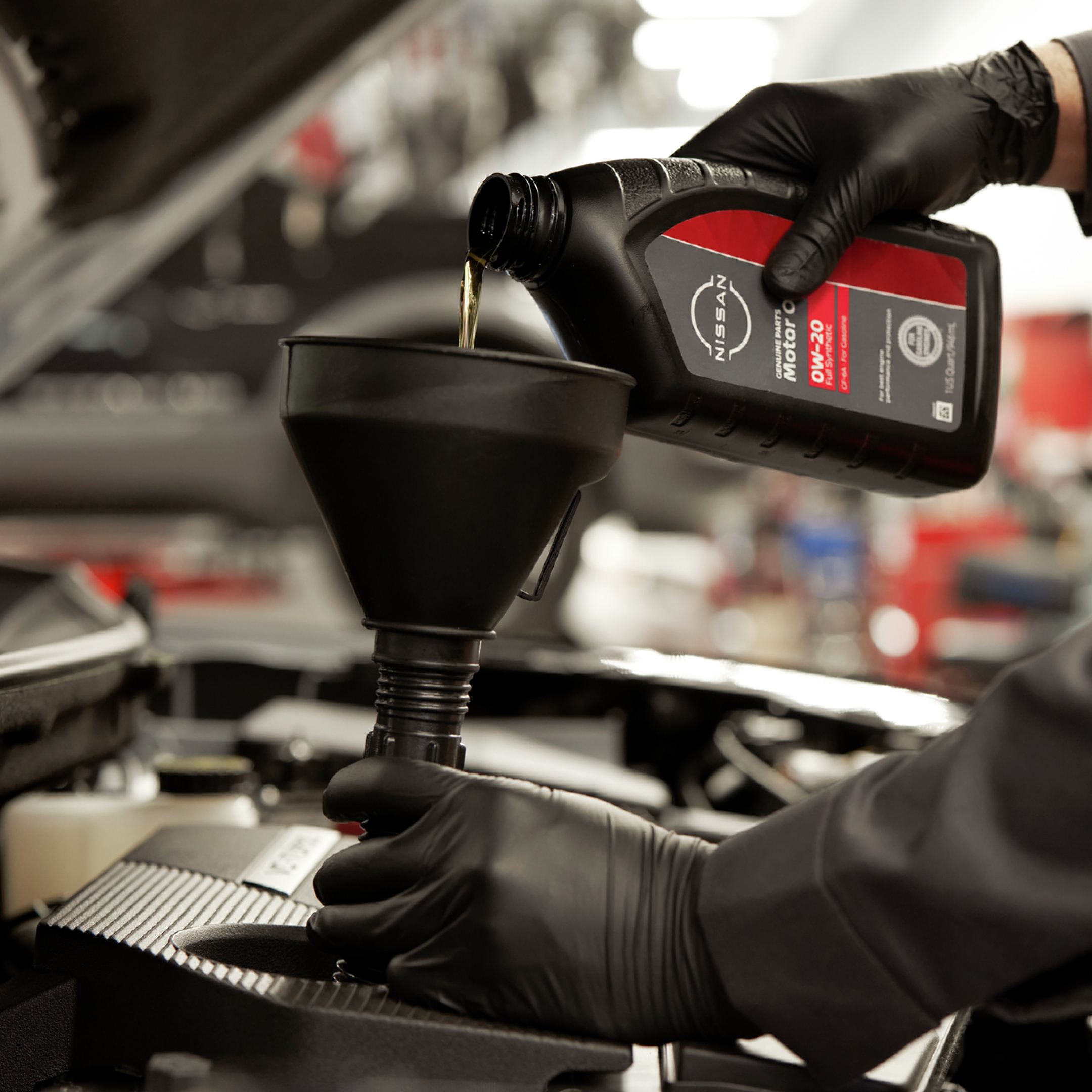 service center technician workin on a car