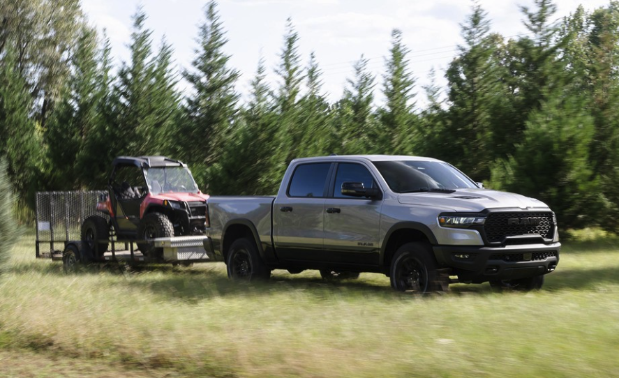 2026 Ram 1500 towing a heavy trailer on a Canadian highway