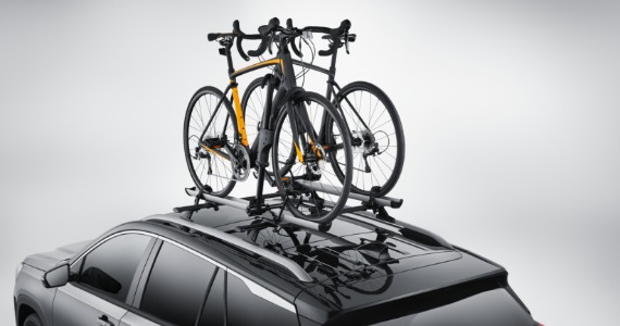 Bicycles mounted on a roof rack accessory for a vehicle