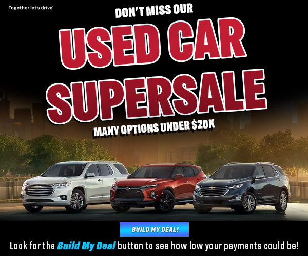 Chevrolet lineup building skyline background