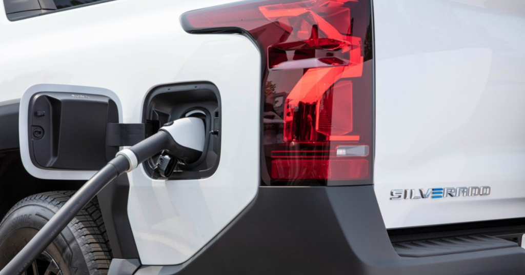 2025 Chevy Silverado EV charging near the rear brake lights