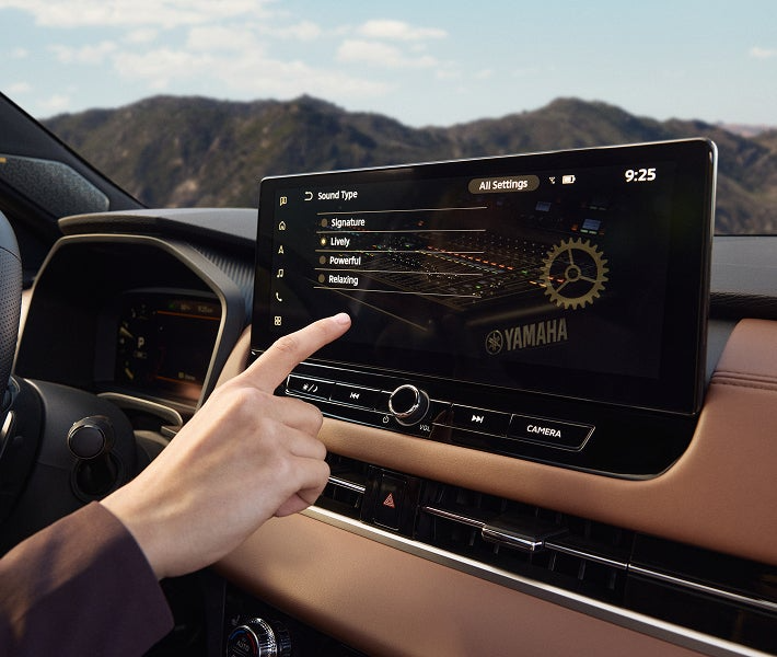 Close-up of 2025 Outlander infotainment and Yamaha audio speakers