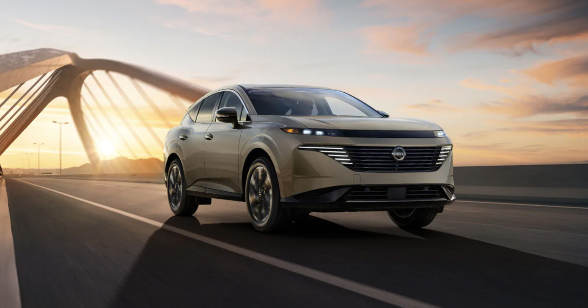2026 Nissan Murano driving on a bridge at sunset