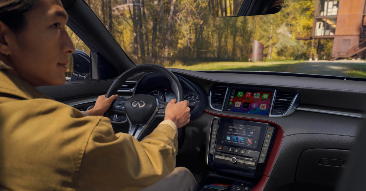 Driver holding an INFINITI steering wheel