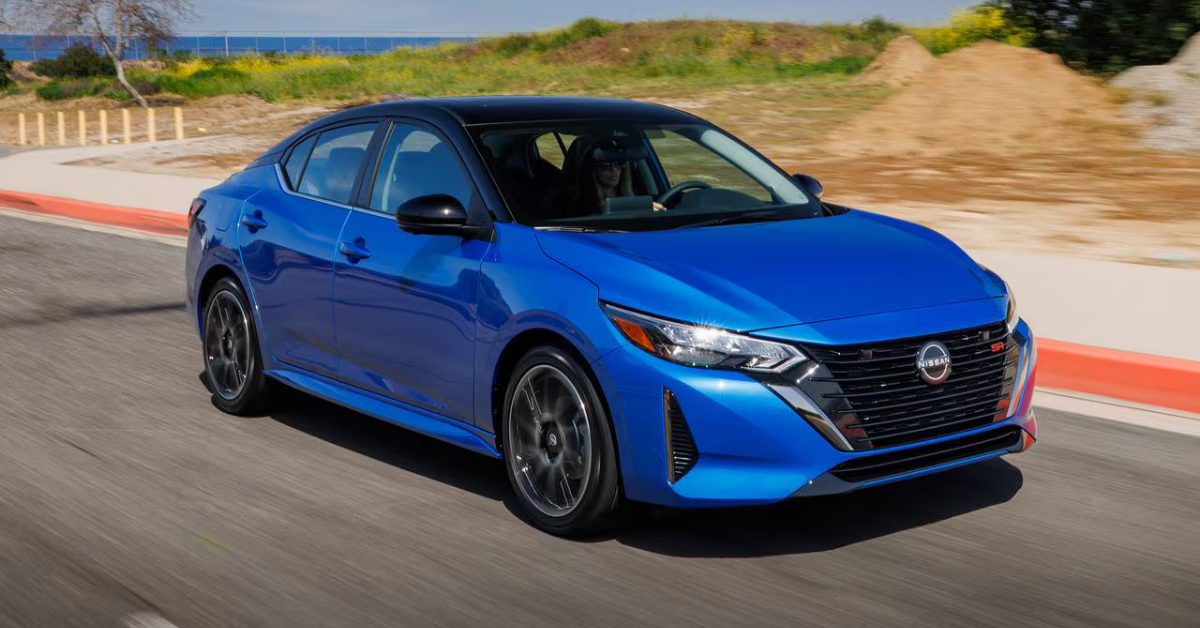2025 Nissan sentra exterior in blue driving down a country highway