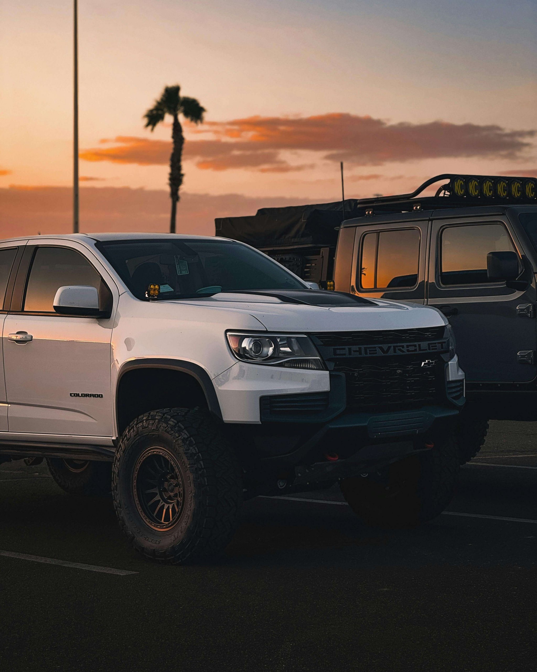 A Chevy Colorado parked in a scenic locale, one example of a pickup truck with 4WD systems installed.