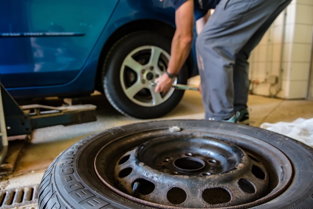 A mechanic changing a tire.
