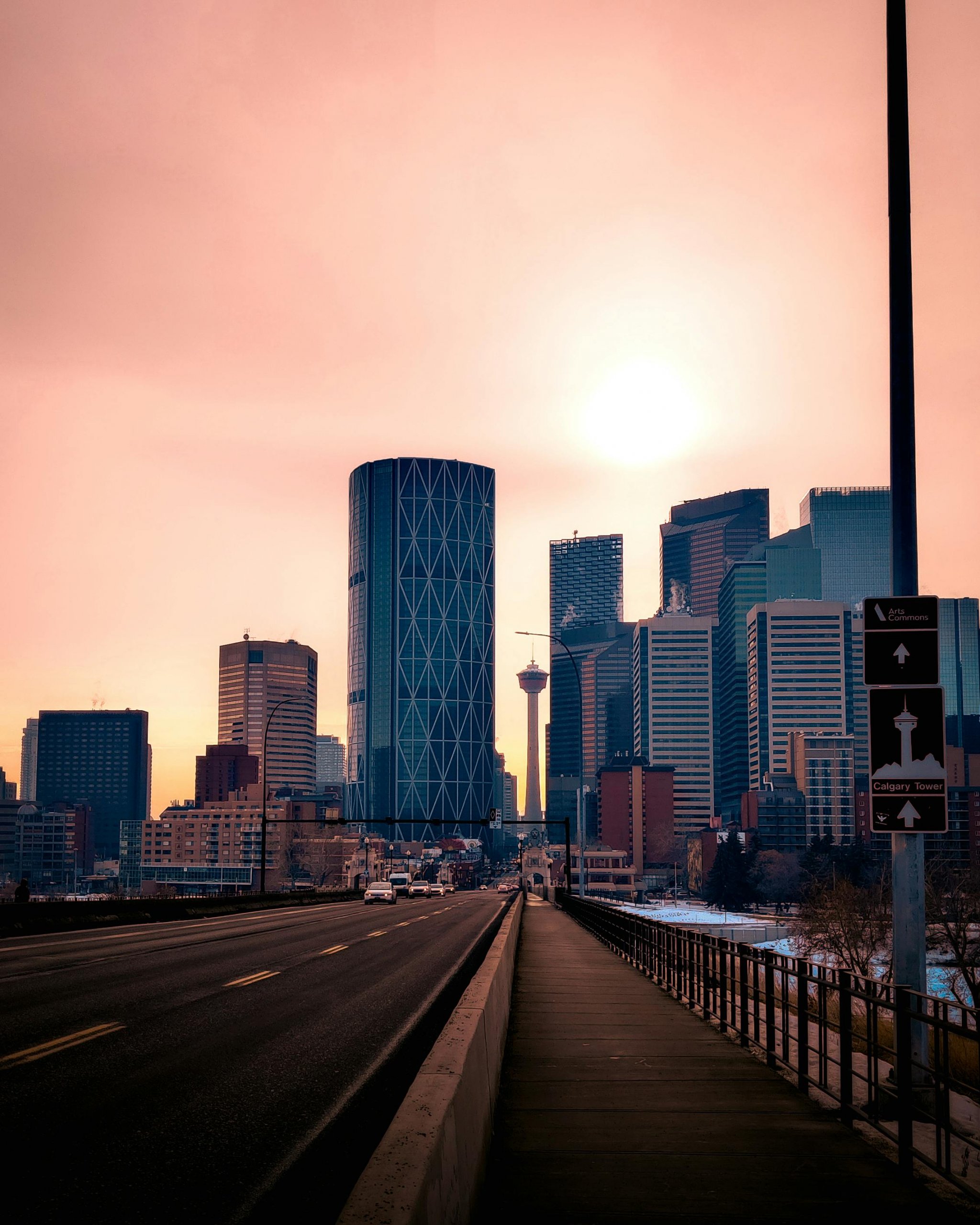 A busy Calgary street with cars driving during rush hour.