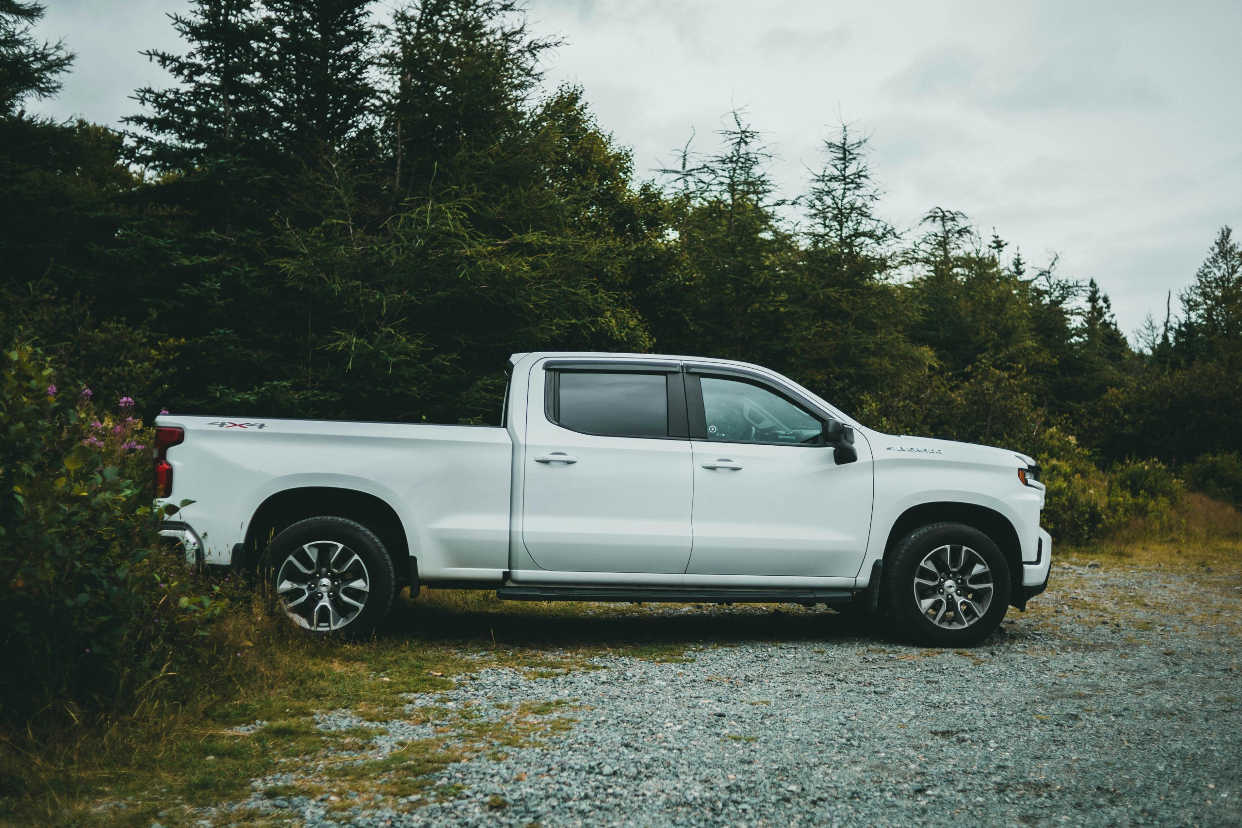 A Chevrolet Silverado parked on rocky terrain, showcasing its rugged reputation