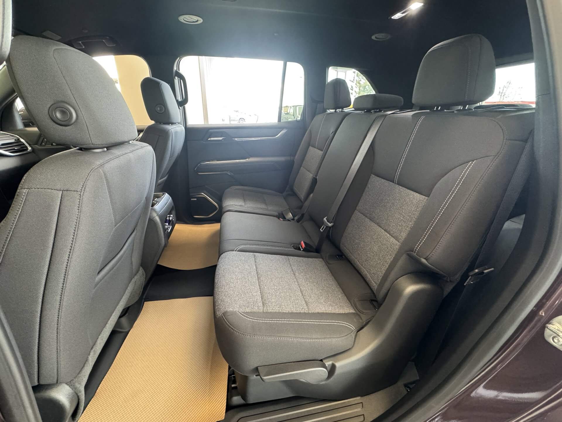 View of the back seating of the 2025 GMC Acadia, showcasing its roomy interior