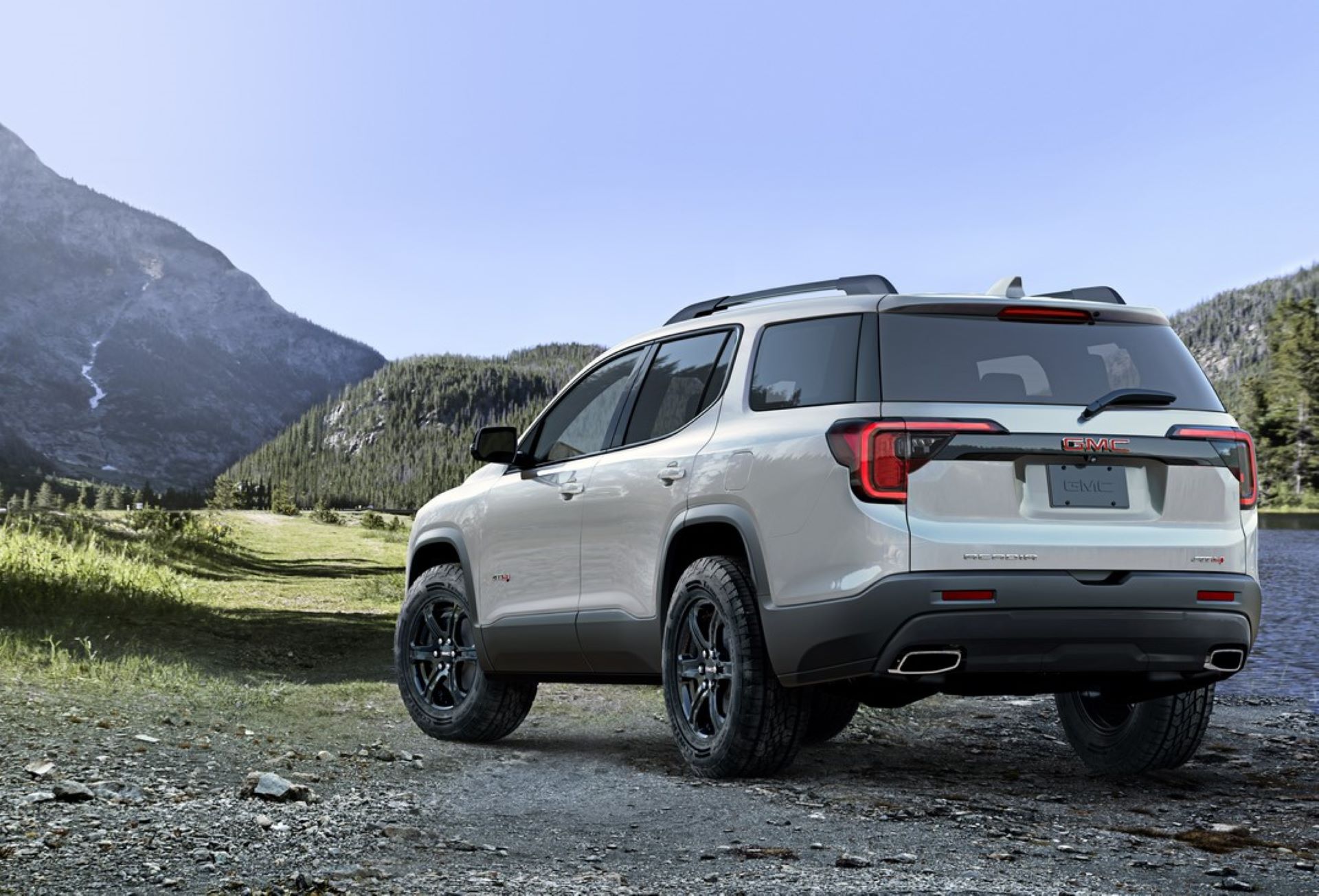 a New GMC Acadia AT4 offroad in the mountains near Bragg Creek
