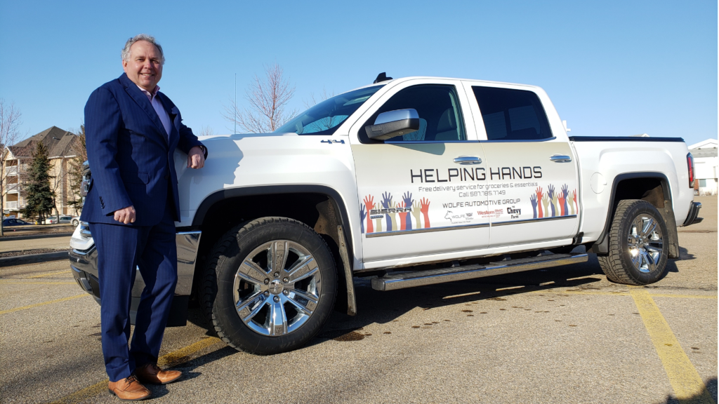 Doug Airey with the Western GMC Buick Helping Hands Sierra.