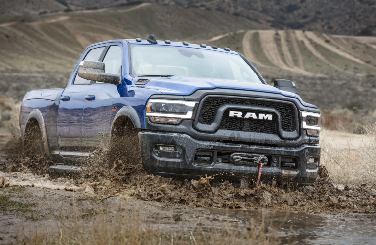 2020 Ram 2500 Power Wagon winnipeg, manitoba heavy-duty truck model exterior shot with blue paint color driving through mud