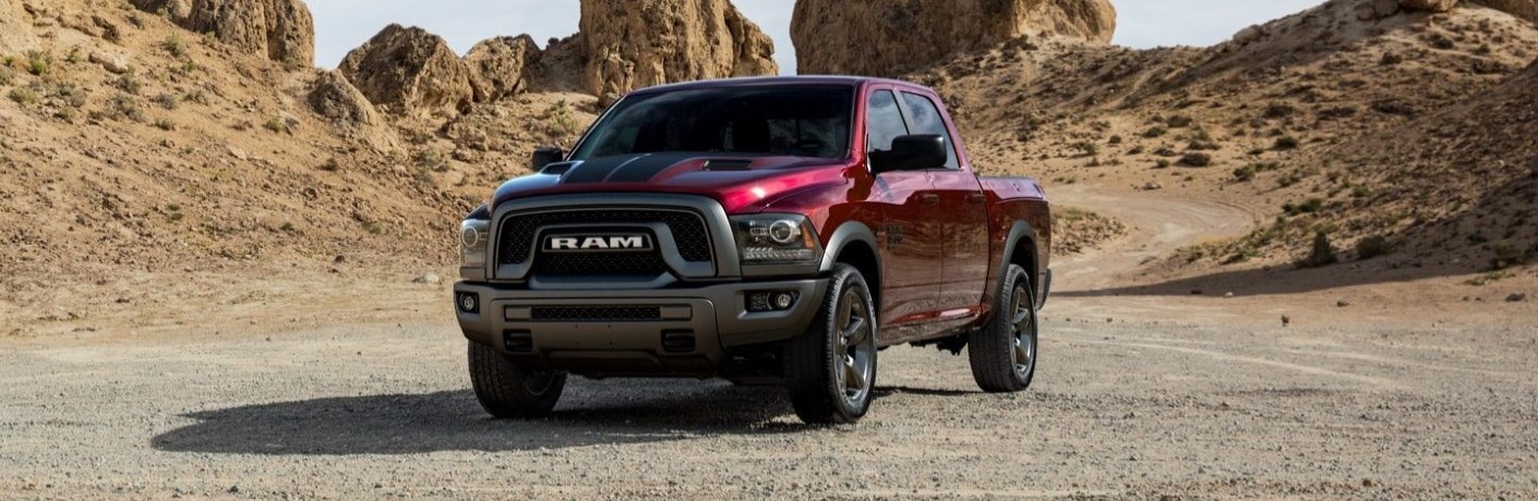 2020 Ram 1500 Classic winnipeg, manitoba Warlock exterior shot with dark red scarlet paint color parked on a desert plain near hills and dunes