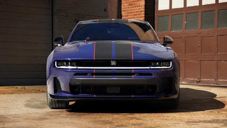head-on front view of a Dodge Charger Daytona in the Purple Haze purple anniversary colour outside a brick garage