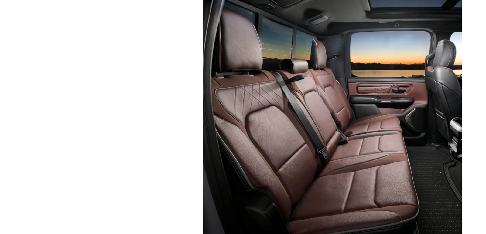 2026 Ram 1500 premium brown leather rear cabin with a panoramic roof at sunset