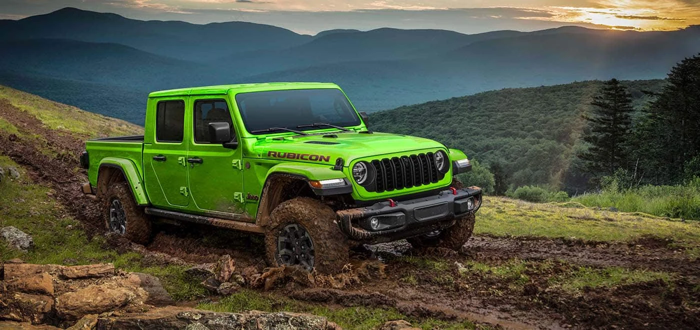 Jeep Gladiator Rubicon climbing a muddy off road grade