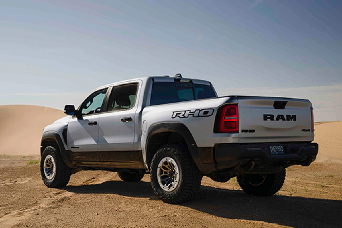Empty 2026 Ram 1500 cargo box with the tailgate down showing the bed floor and rails