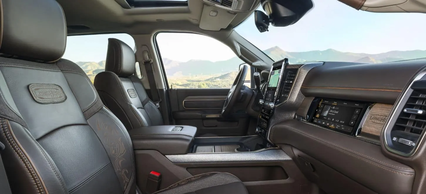 Ram 3500 Longhorn interior with brown leather seats and wood trim