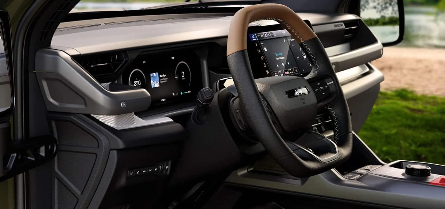 2026 Jeep Recon dashboard with tan wrapped steering wheel, digital cluster and centre touchscreen
