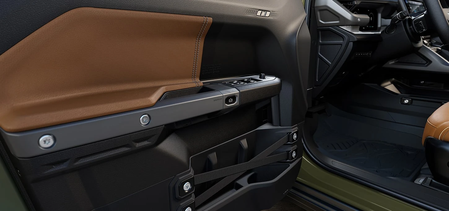 Jeep Recon removable door panel showing the exposed mounting hardware