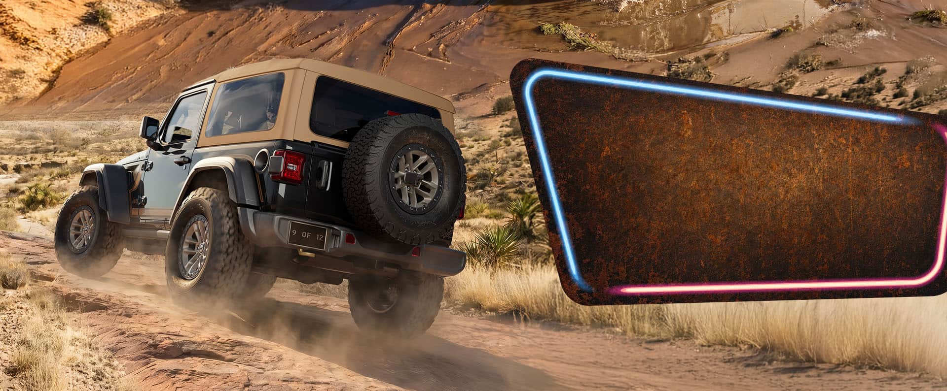 rear view of a 2027 Jeep Wrangler Laredo with tan soft top and 4WD decal kicking up dust