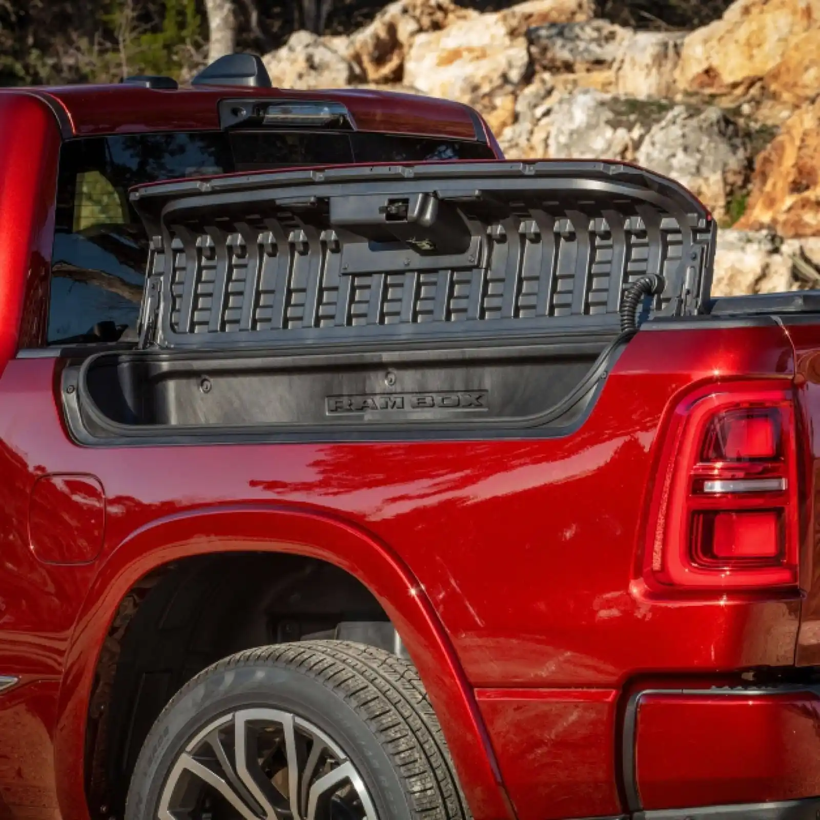open RamBox bed side storage compartment on a Ram 1500