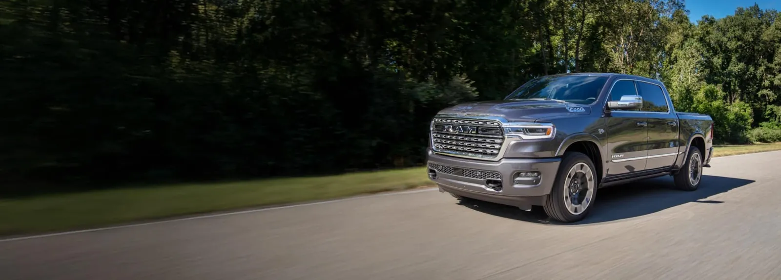 2026 Ram 1500 in motion on an open rural highway
