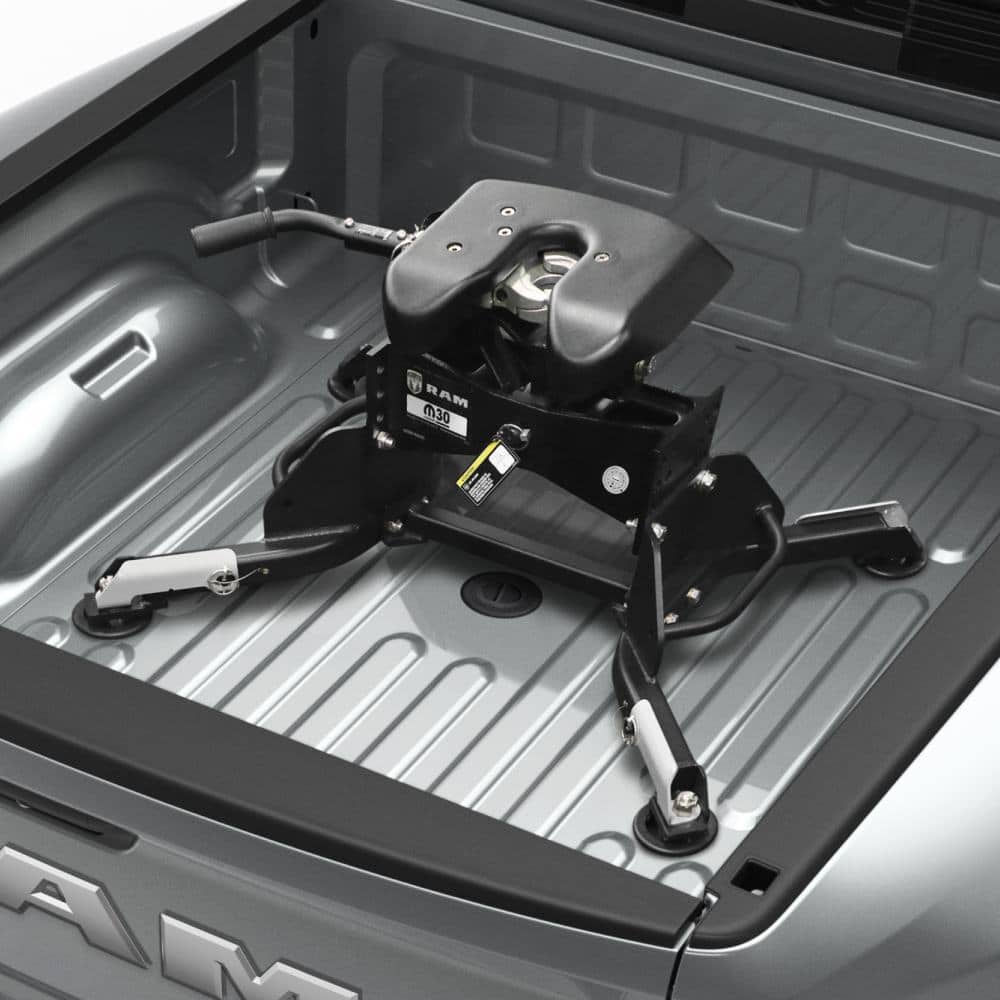 factory fifth wheel hitch mounted on the gooseneck prep pucks in a Ram heavy duty bed