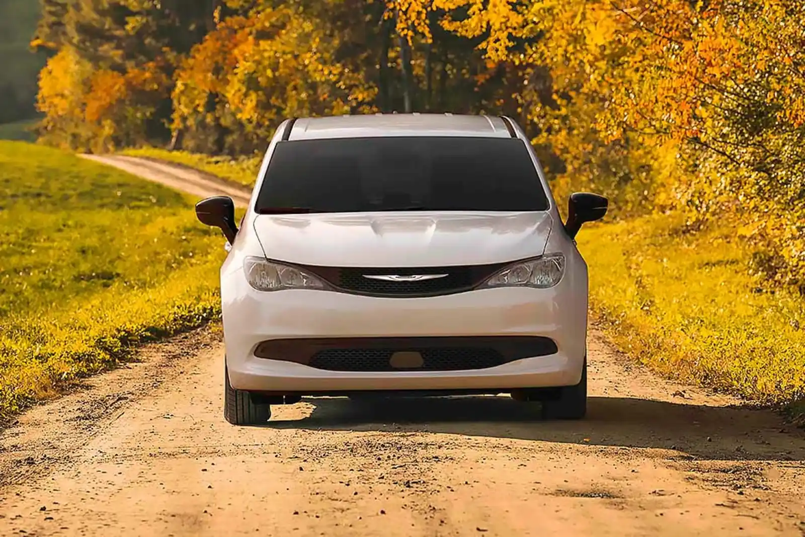 Silver 2026 Chrysler Grand Caravan shown front three quarter on a road