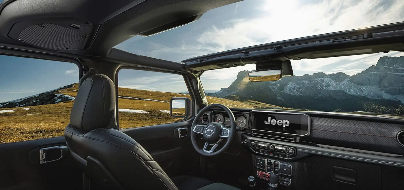 2026 Jeep Wrangler interior cabin showing the dashboard and touchscreen