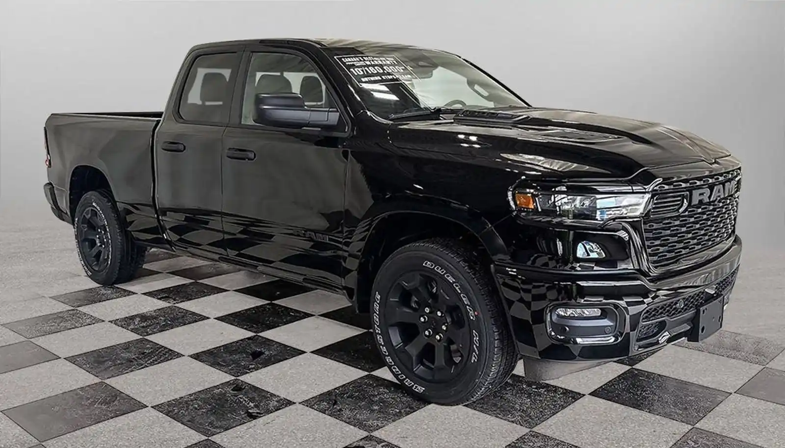 black Ram 1500 Express Quad Cab front three quarter on the dealer lot